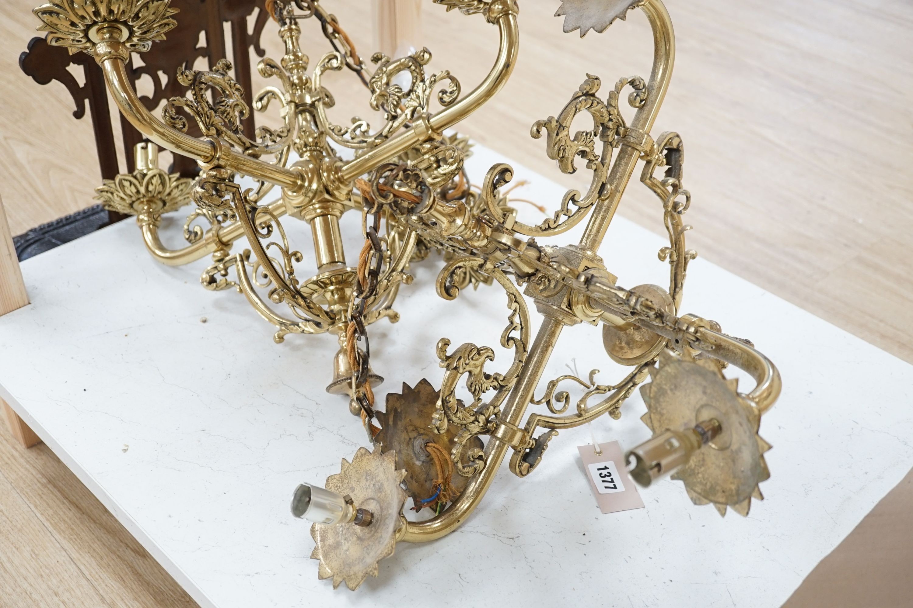A pair of brass four light ceiling fittings, 41cm high